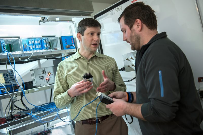 Dr. Jonathan Black and a student at the Hume Center